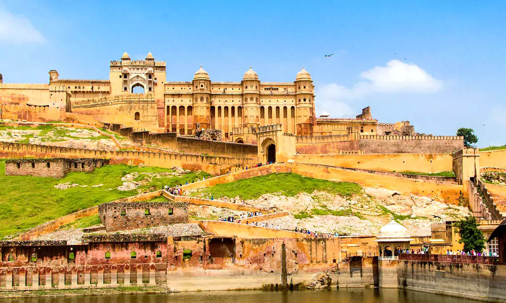 Amer Fort Jaipur, a UNESCO World Heritage Site, showcases Rajput and Mughal grandeur with its majestic architecture, mirror palaces, and stunning hilltop views over Maota Lake.