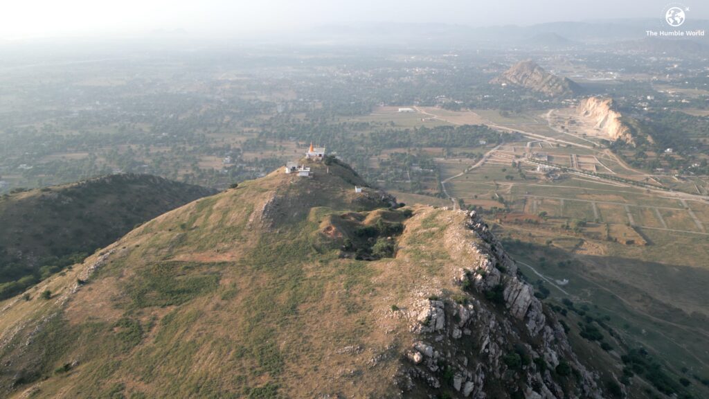 Shan Valley Jaipur with green fields and calm hills.