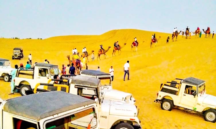 Colorful Kalbelia dancers performing during cultural evening at Sam